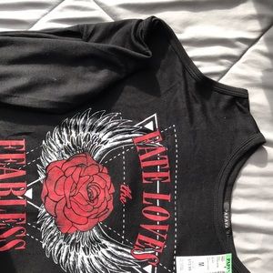 Long sleeve shirt with cut out shoulders.